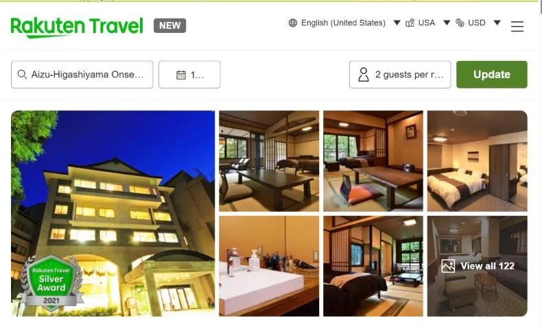 Rakuten Travel's page for Aizu-Higashiyama Onsen Kutsurogijuku Shintaki, showing a timber-fronted building lit from within at blue hour with a Rakuten Silver Award badge, and tatami and western rooms.